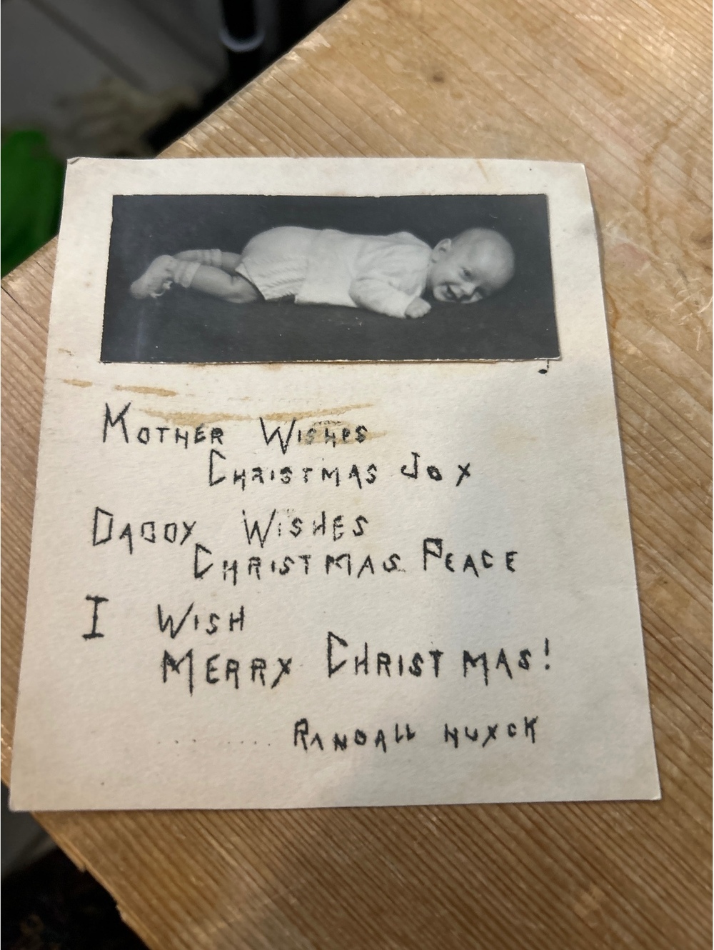 Vintage photo of baby and something about mother’s wishes and Christmas